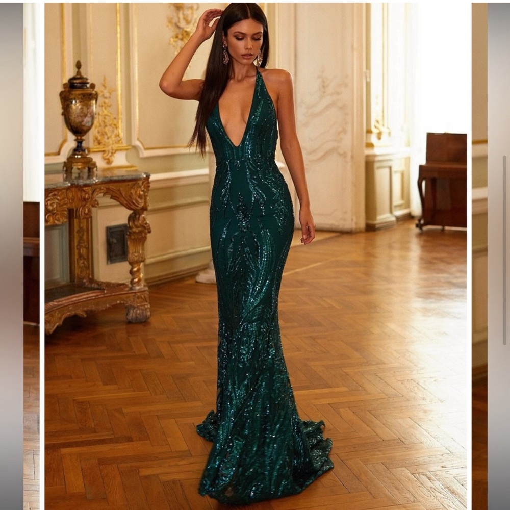 Bought this one and the halter top. Went with the other dress. Stunning dress.